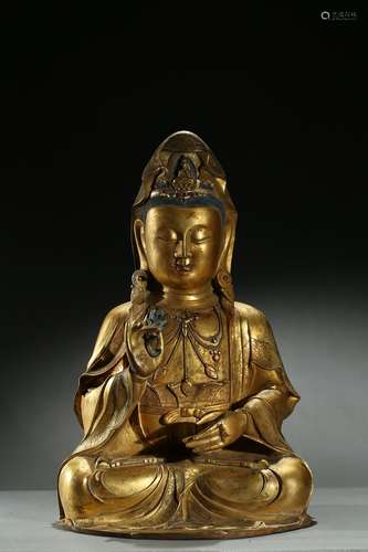 A large gilt-bronze statue of Guanyin