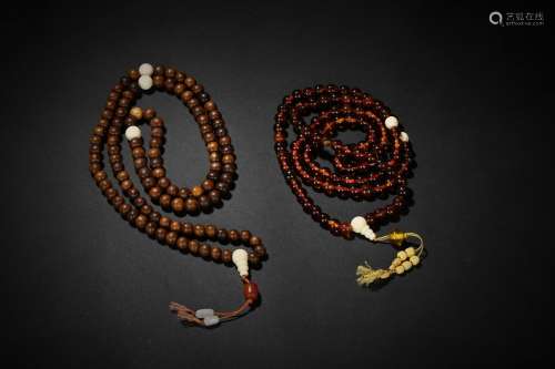 A set of two amber and jichimu prayer's beads