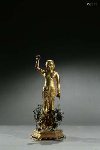 A gilt bronze figure of infant buddha