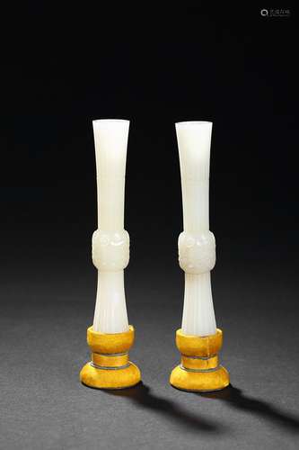 A pair of miniature white jade gu vessels