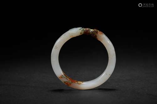 A white jade 'dragon' bangle