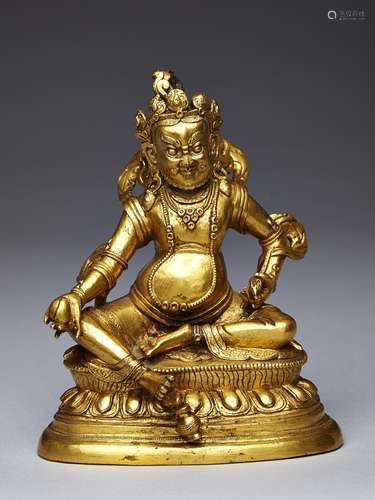 A gilt-bronze figure of Jambhala