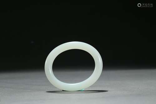 A small white jade bangle