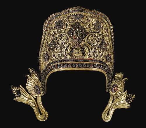 A GILT-COPPER REPOUSSÉ CROWN OF INDRA INLAID WITH PASTE AND SEMI-PRECIOUS STONESNepal, 17th Century