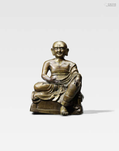 西藏 约十六世纪 铜错银尊者像