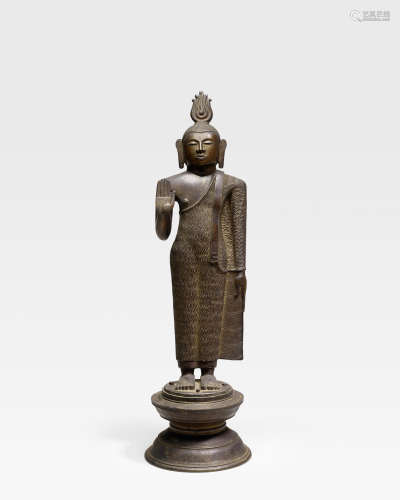 A LARGE GILT COPPER FIGURE OF BUDDHA SRI LANKA, KANDYAN PERIOD, 18TH CENTURY