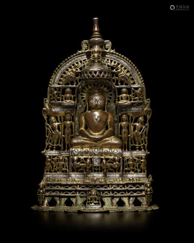 A LARGE SILVER AND COPPER INLAID BRASS SHRINE TO SUMATINATHA WESTERN INDIA, DATED CIRCA 1353