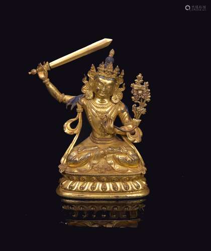 A Gilt-Bronze Figure Of Manjushri