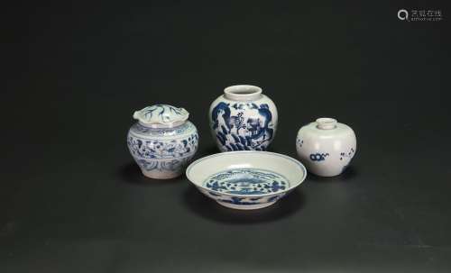 A Group Of Four Blue And White Jugs And Dish