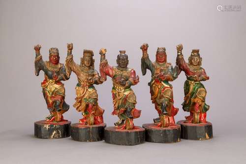 A Collection of Teak Wood Statues