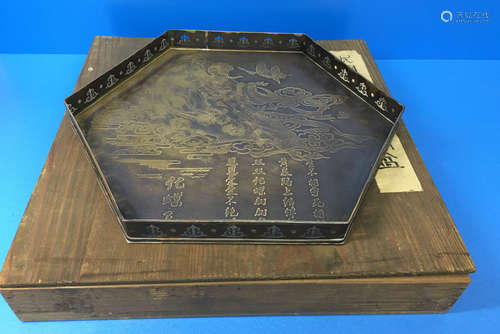 A HEXAGONAL BRONZE PLATE