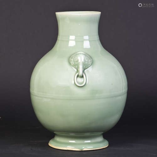 A CELADON PORCELAIN ZUN WITH HANDLES OF ELEPHANT-HEAD FORM