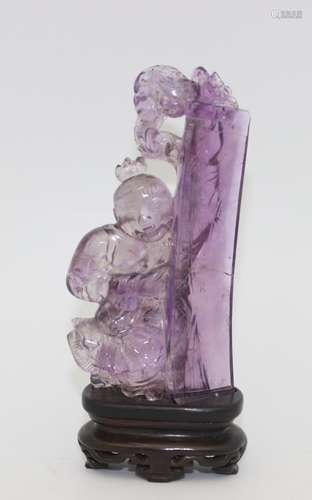 AMETHYST CARVED SCULPTURE WITH WOOD BASE