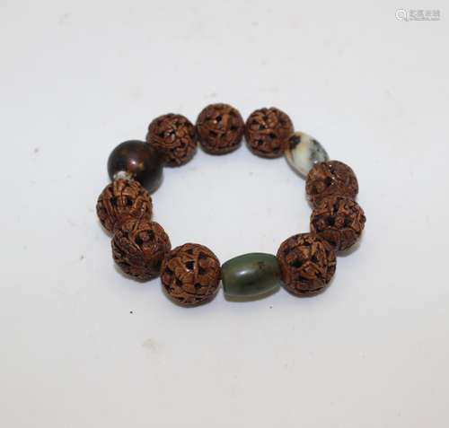 CARVED NUT AND STONE BEAD BRACELET