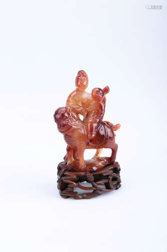 A Chinese Carved Agate Guanyin Figure with Base