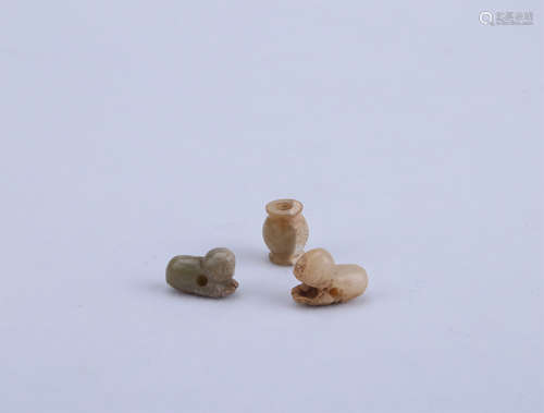 A Set of Three Chinese Carved Jade Pendants