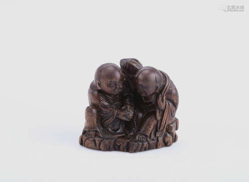 A Chinese Carved Chenxiang Two Figures Decoration