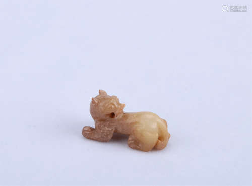 A Chinese Carved Jade Foo-Dog