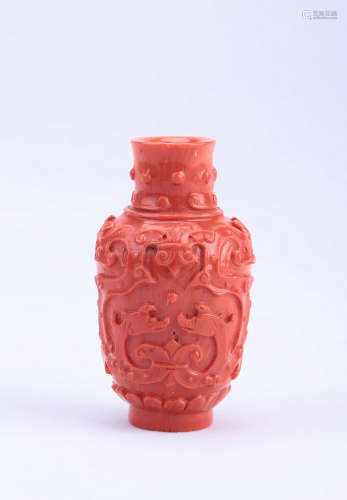 A Chinese Carved Coral Red Snuff Bottle