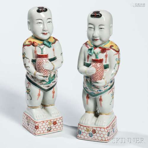 Pair of Enameled Porcelain Figures of Boys