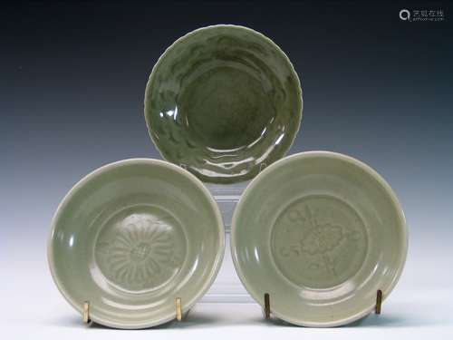 Three Chinese celadon porcelain dishes.