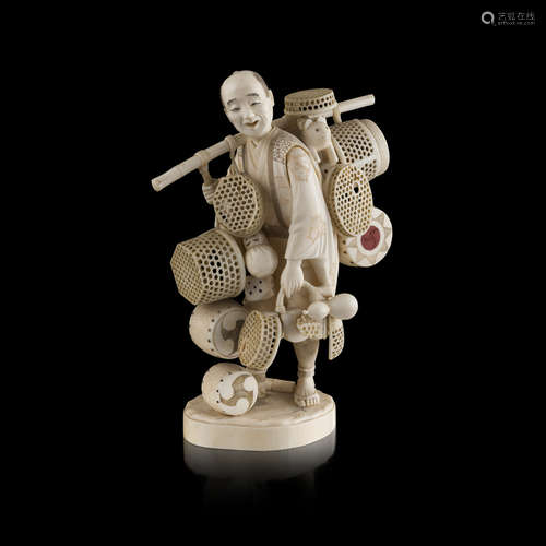 CARVED AND PIERCED IVORY OKIMONO OF A BASKET VENDOR,BY TOSHIMASA, MEIJI PERIOD