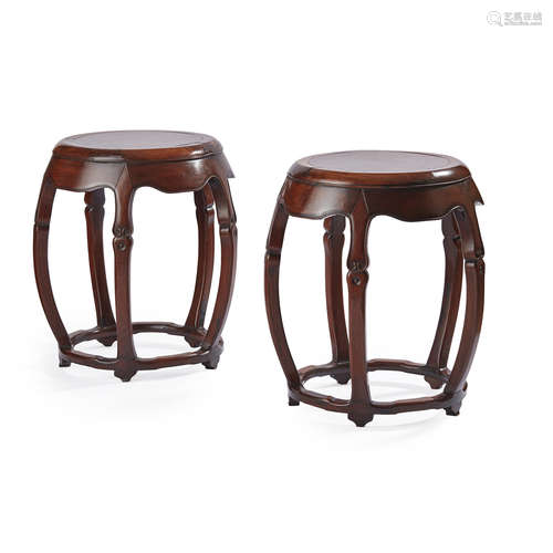 RARE PAIR OF HUANGHUALI, HONGMU AND HUAMU BARREL-FORM STOOLS,QING DYNASTY, 18TH CENTURY