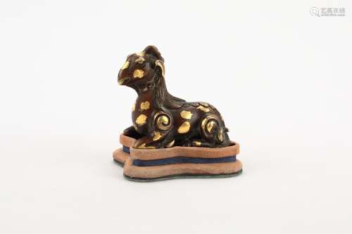A Chinese Gilt-Splashed Bronze Foo-Dog