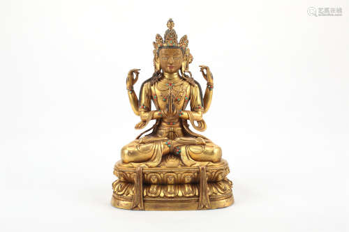 A Chinese Gilt Bronze Four-Arms Buddha