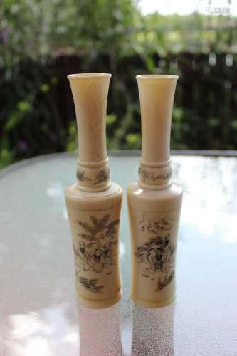 Pair of Chinese carved bone vases with 3 men