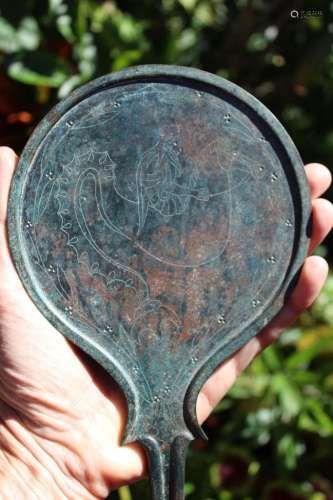 Museum quality Etruscan bronze mirror with Poseidon riding
aSeaHorse,circa 400 BC