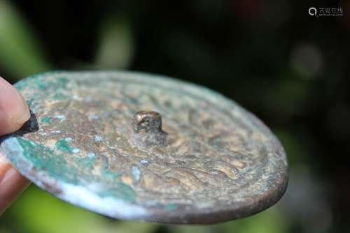 Islamic bronze mirror with Arabic ornaments, 700-800 AD, 6.5 cm