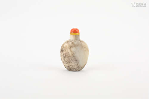 A CHINESE CARVED WHITE JADE SNUFF BOTTLE