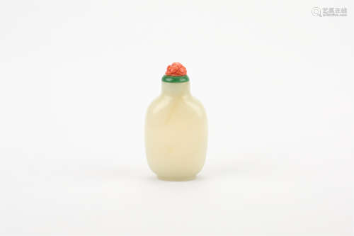 A CHINESE CARVED WHITE JADE SNUFF BOTTLE