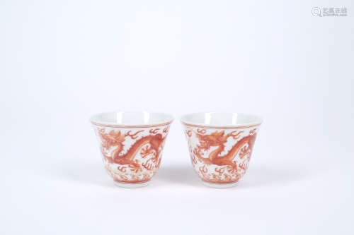 A PAIR OF CHINESE IRON-RED PORCELAIN CUPS