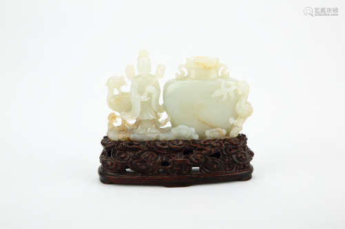 A CHINESE CARVED JADE FIGURE WITH STAND