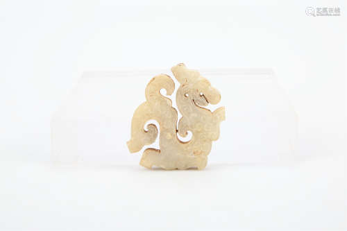 A CHINESE CARVED JADE DRAGON PENDANT