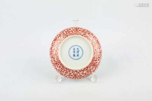 A CHINESE IRON-RED PORCELAIN PLATE