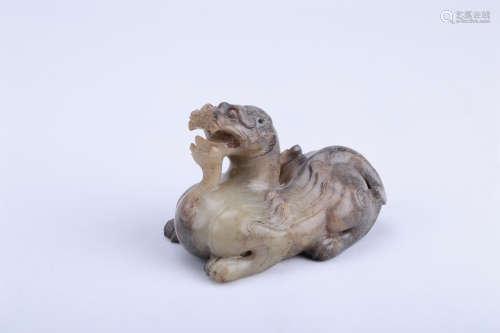 A CHINESE CARVED JADE FOO-DOG