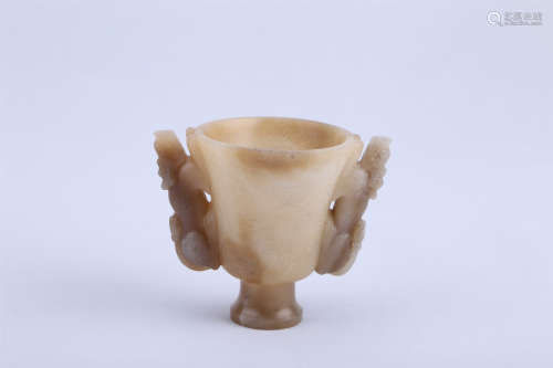 A CHINESE CARVED JADE CUP WITH PHENIX PATTERN