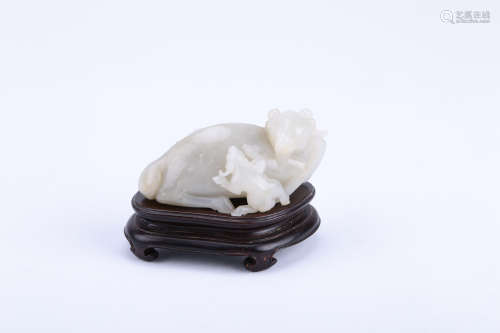 A CHINESE CARVED JADE GOAT DECORATION WITH STAND