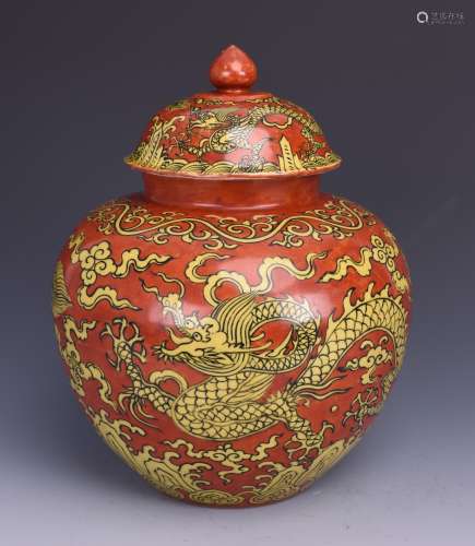 A CORAL-GROUND DRAGON JAR WITH COVER