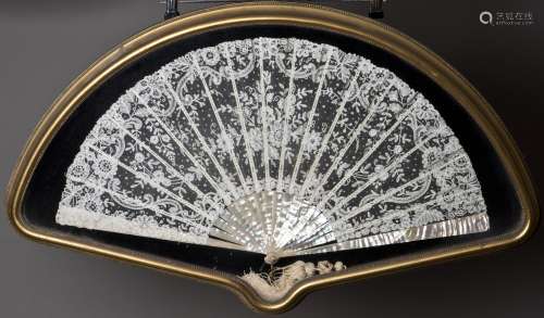 A GLASS FRAMED LACE FAN WITH MOTHER-OF-PEARL SPINE