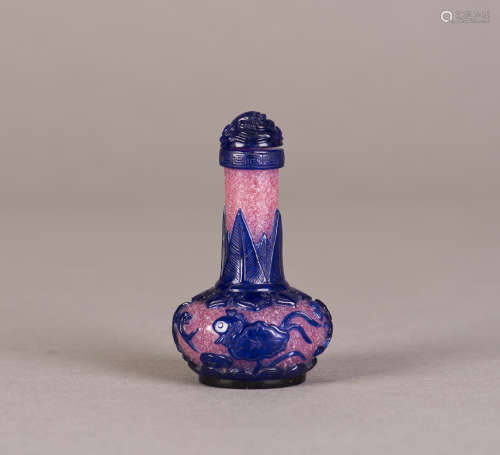 A PEKING GLASS SNUFF BOTTLE WITH LOTUS RELIEF