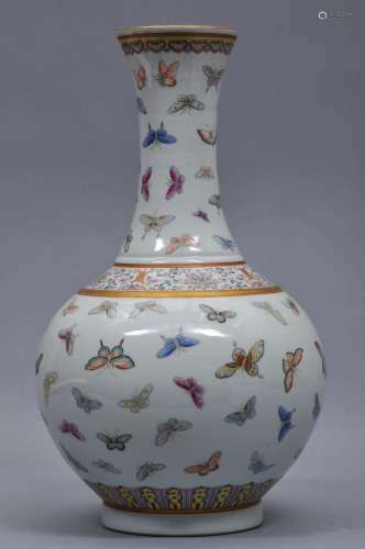 Porcelain vase. China. Kuang Hsu mark and period (1875-1908). Bottle form. Design of The Hundred Butterflies. 15-3/4