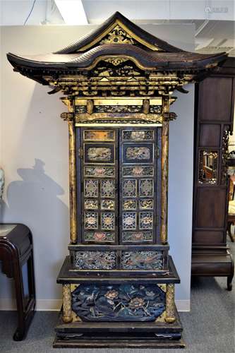 Household Shrine. Japan. 19th century. Surface with lotus plants, phoenixes, cranes, shishi and heraldic emblems all painted and with gilt. Fittings of engraved copper. Gilt interior with the doors painted with standing Buddhist Divinities., 90