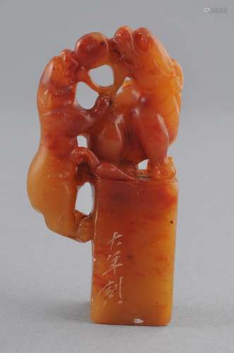 Soapstone seal. 19th century. Honey coloured stone. Final in the form of a pair of Chih Lung and a pearl. 2-1/2