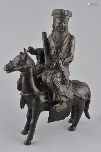 Bronze censer. China. 19th century. Cast in the form of an immortal riding a mule. 9