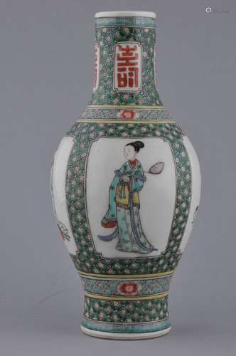 Porcelain vase. China. Early 20th century. Bottle form. Famille Verte decoration of reserves of the immortals on a brocade pattern ground. Shou medallions on the neck. Artemesia leaf on the base. 10