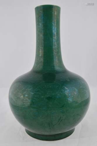 Porcelain vase. China. 20th century. Bottle form. Monochrome forest green glaze. 17